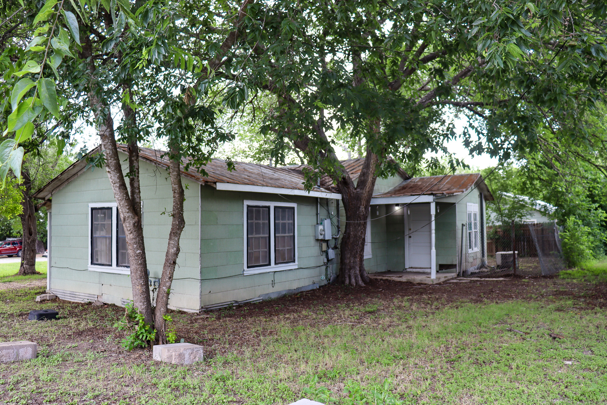803 3rd Street Lockhart, TX 78644 - Photo 3 of 15 a front view of a house with garden