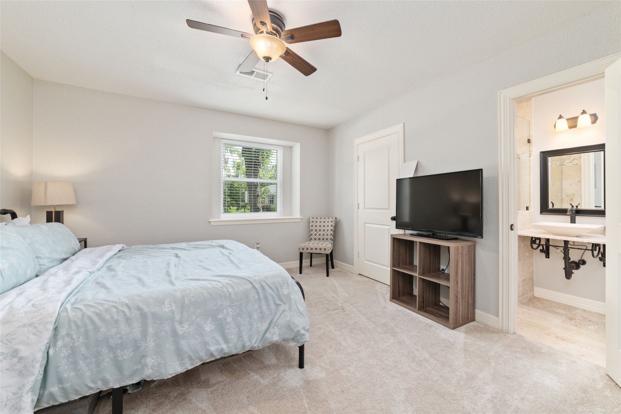 3815 April Lane Houston, TX 77092 - Photo 21 of 33 a bedroom with a bed and a flat screen tv