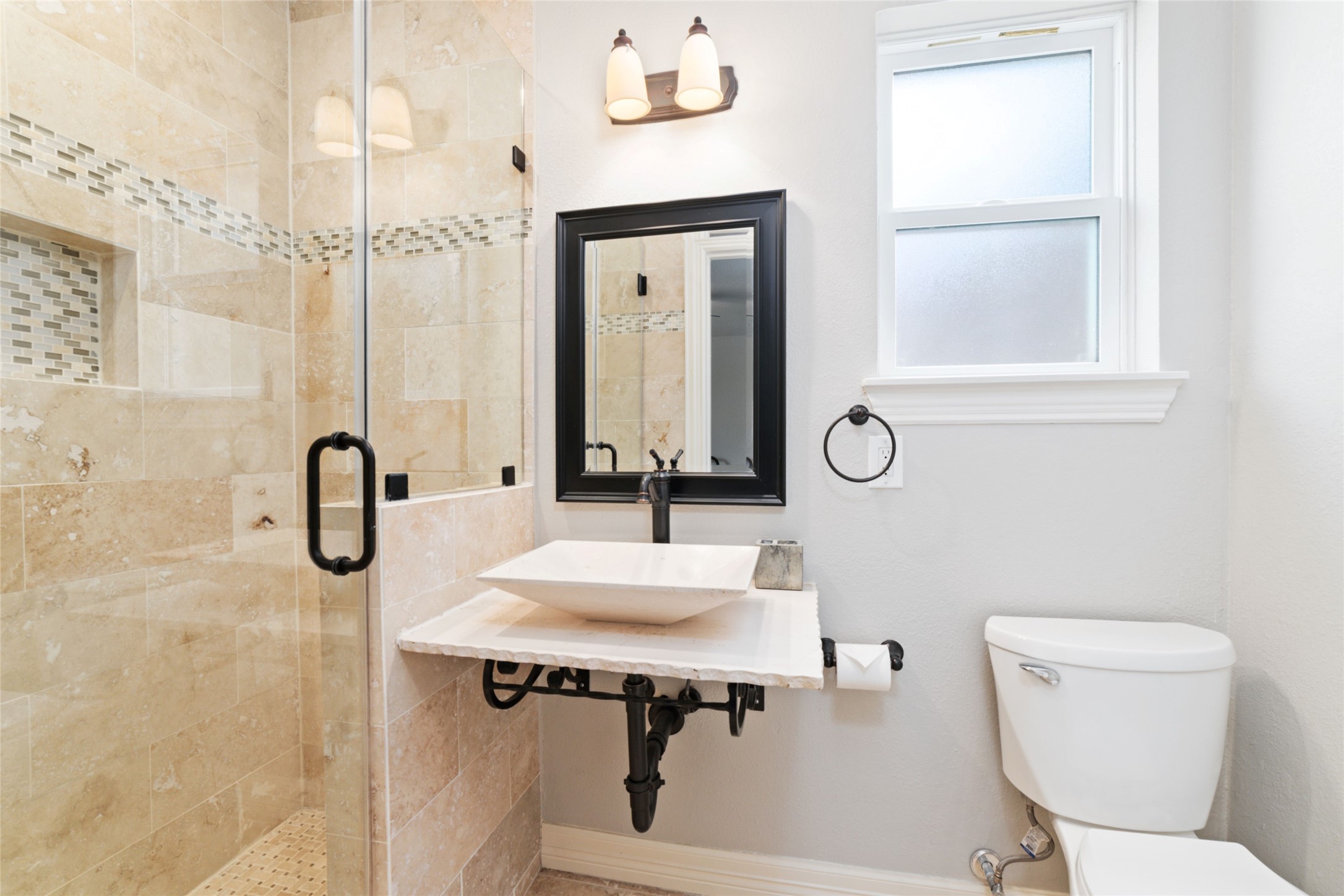 3815 April Lane Houston, TX 77092 - Photo 23 of 33 a bathroom with a sink a toilet and a mirror