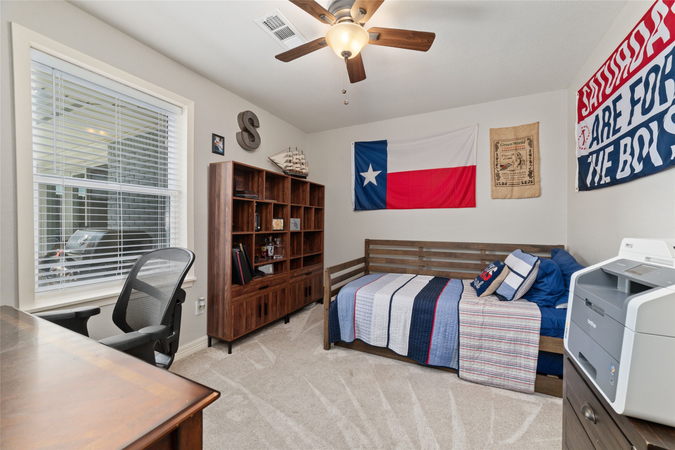 3815 April Lane Houston, TX 77092 - Photo 27 of 33 a bedroom with a large bed and a chandelier