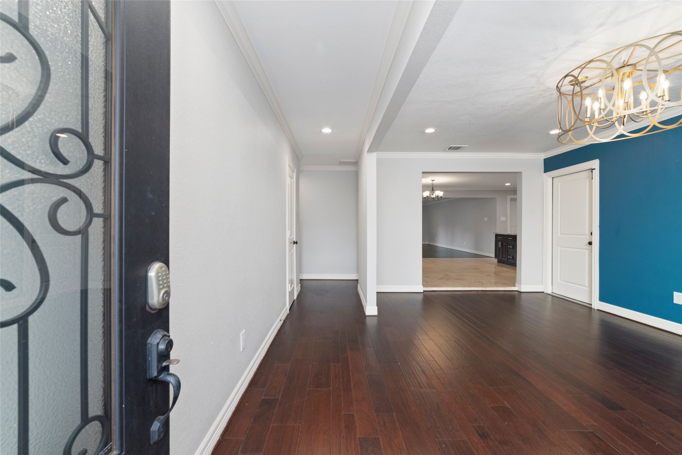 3815 April Lane Houston, TX 77092 - Photo 3 of 33 a view of an empty room with wooden floor and a window