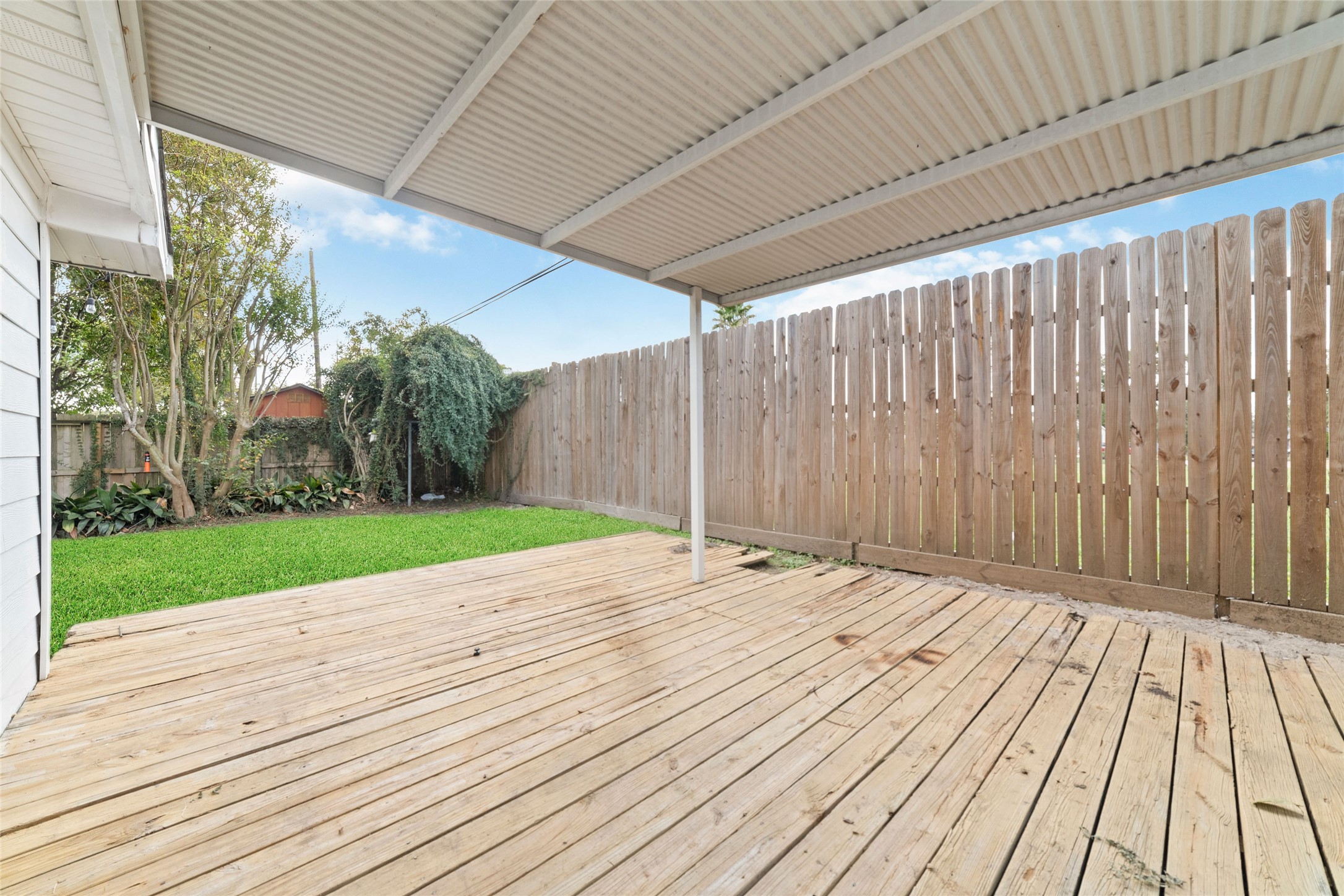 3815 April Lane Houston, TX 77092 - Photo 32 of 33 a view of backyard with wooden floor and fence