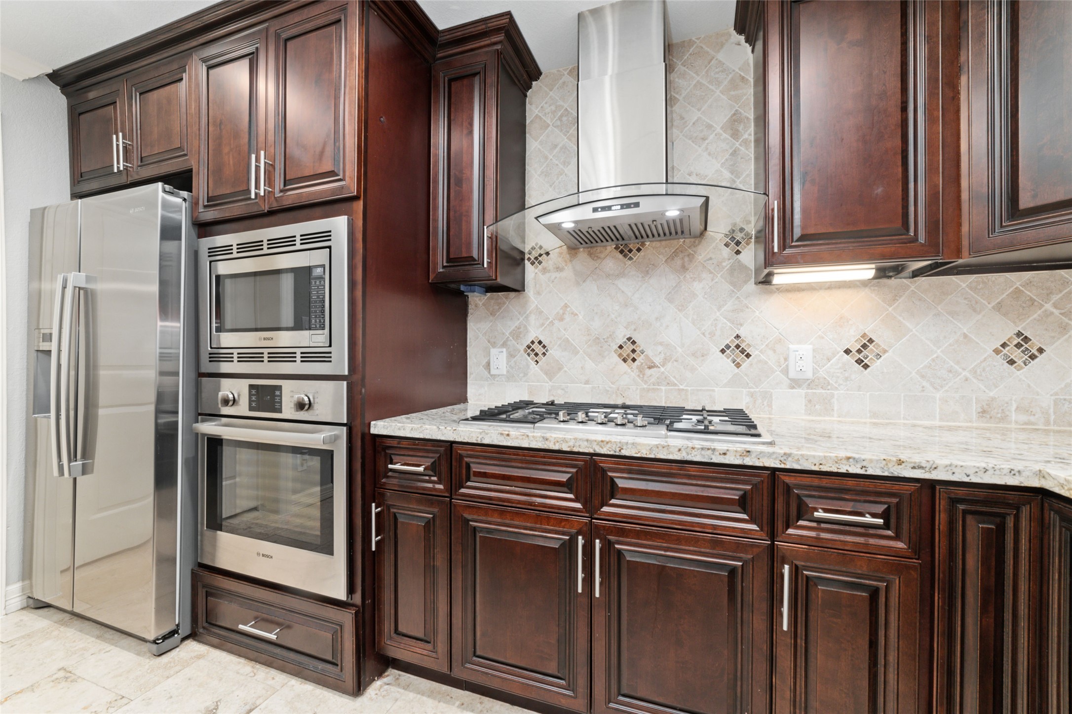 3815 April Lane Houston, TX 77092 - Photo 9 of 33 a kitchen with stainless steel appliances granite countertop a refrigerator and a stove