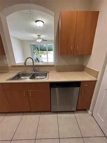 a kitchen with a sink and a window