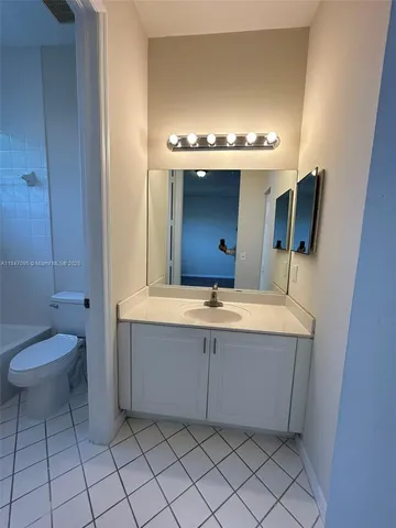 a view of swimming pool with seating space and hardwood floor