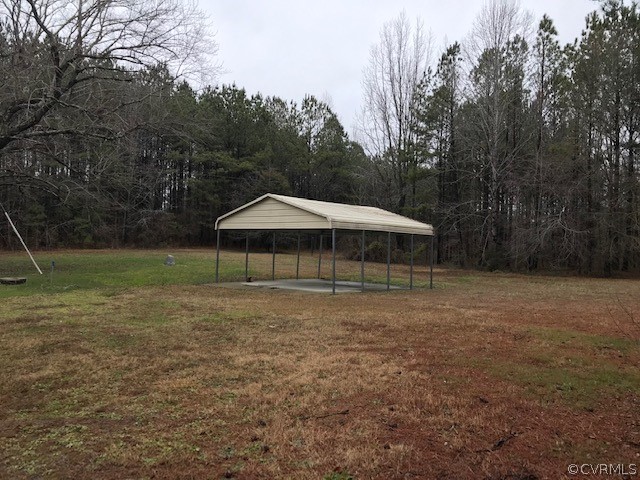 7867 Old Stage Road Dolphin, VA 23843 - Photo 13 of 19 a backyard of a house with wooden fence