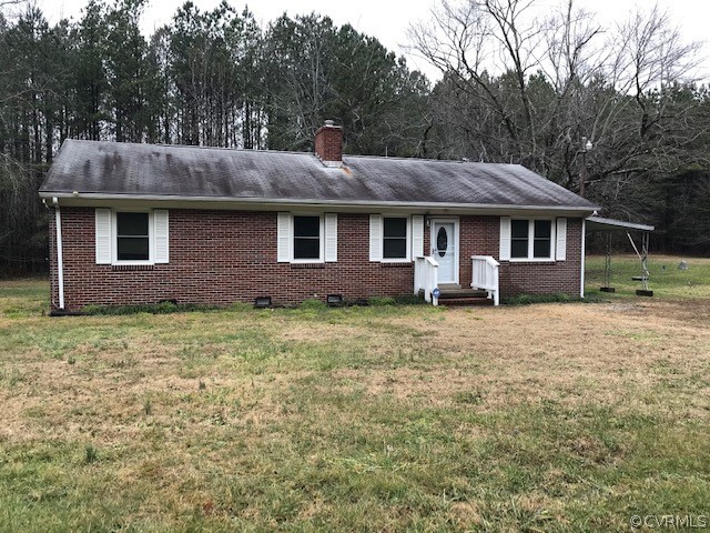 7867 Old Stage Road Dolphin, VA 23843 - Photo 18 of 19 a front view of a house with garden
