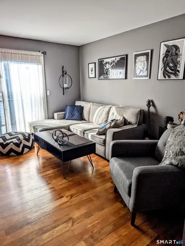 a living room with furniture and window