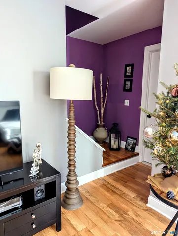 a view of a door and wooden floor