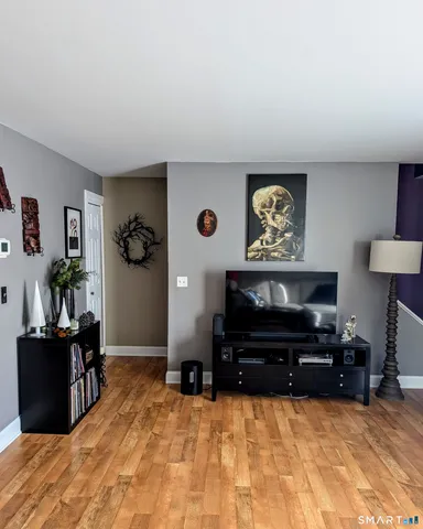 a bed room with a bed and a television