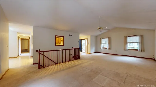 a view of a livingroom with a staircase