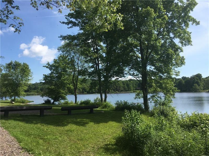 208 Chestnut Lane Chalk Hill, PA 15421 - Photo 12 of 40 a view of a lake with a yard and large trees