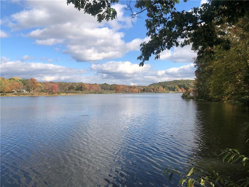 208 Chestnut Lane Chalk Hill, PA 15421 - Photo 23 of 40 a view of a lake with houses in the back
