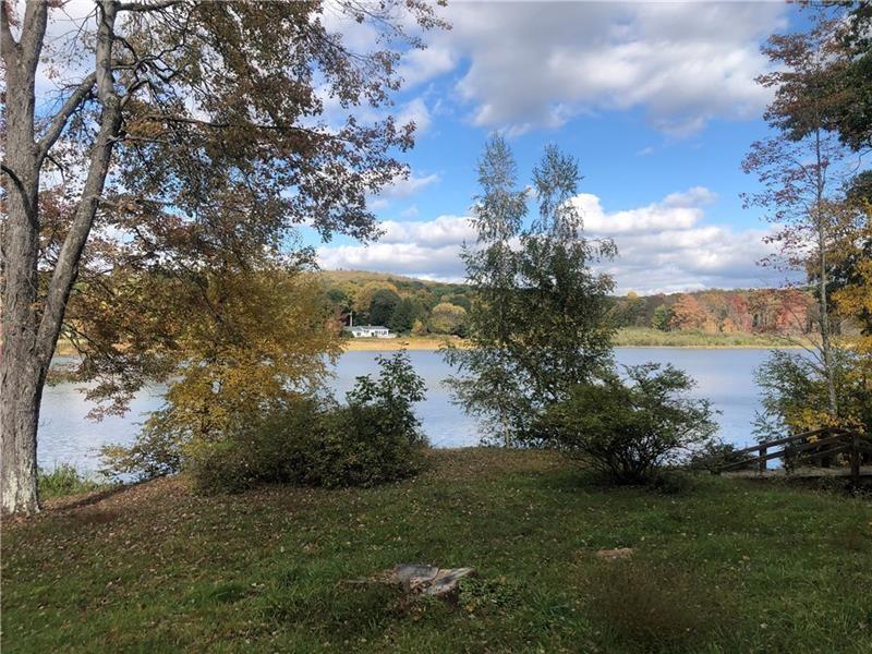 208 Chestnut Lane Chalk Hill, PA 15421 - Photo 34 of 40 a view of a lake with a house in background