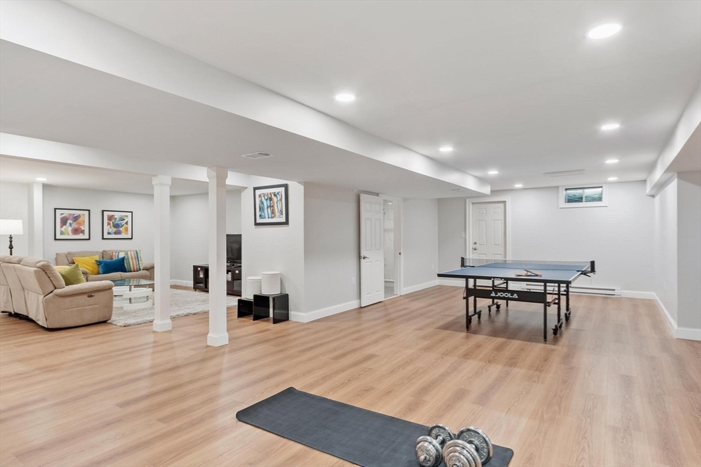 56 Old Marlboro Road Concord, MA 01742 - Photo 22 of 34 a living room with furniture and a wooden floor
