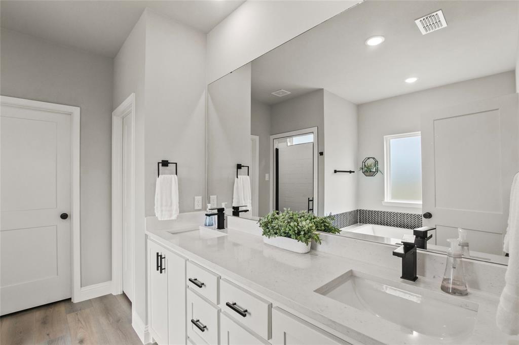 80 Dublin Circle Gordonville, TX 76245 - Photo 15 of 39 a bathroom with a double vanity sink mirror and