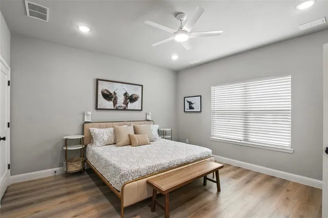 a bedroom with a large bed and a window