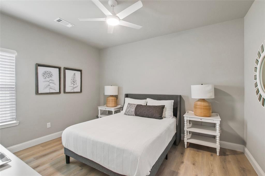 80 Dublin Circle Gordonville, TX 76245 - Photo 23 of 39 a bedroom with a bed and a lamp