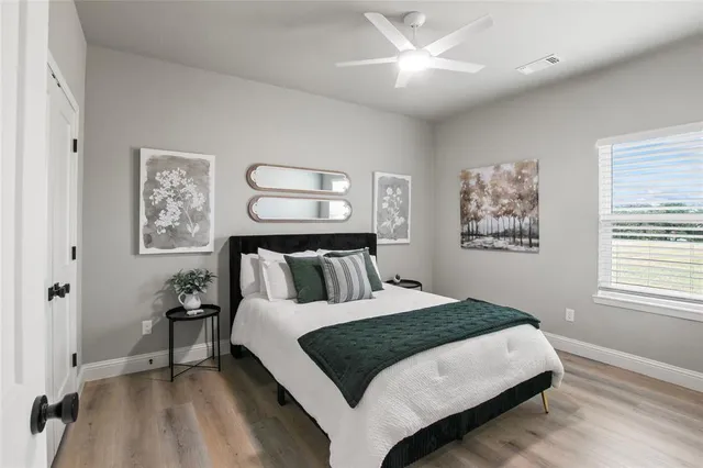 a bedroom with a large bed and a window