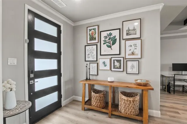 a view of an entryway with wooden floor