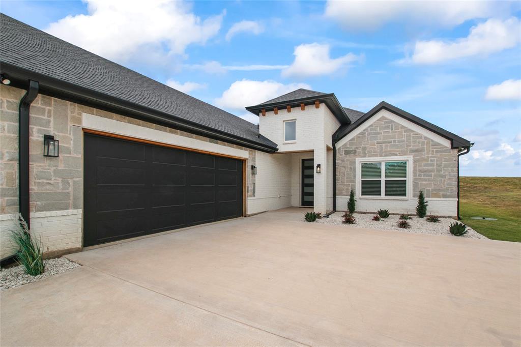 80 Dublin Circle Gordonville, TX 76245 - Photo 35 of 39 a front view of a house with patio