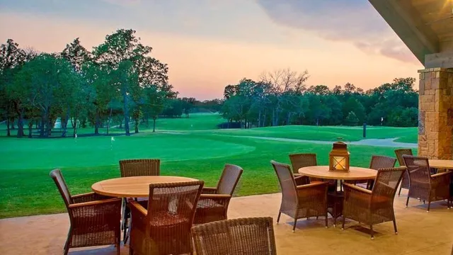 a view of a patio with a table chairs and a table