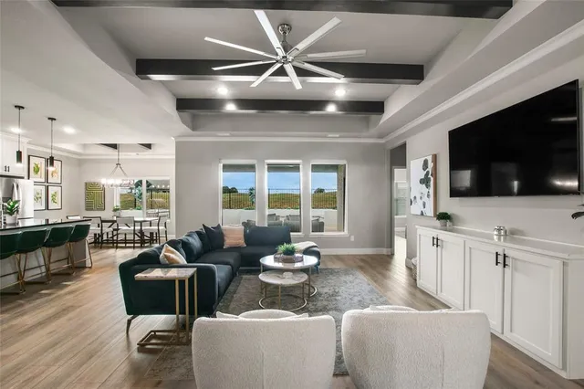 a living room with furniture fireplace and a flat screen tv