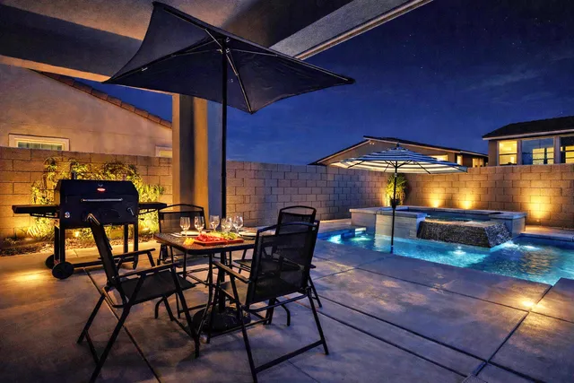 a view of a chairs and table in the patio