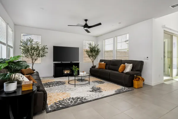 a outdoor dining space with furniture and a kitchen