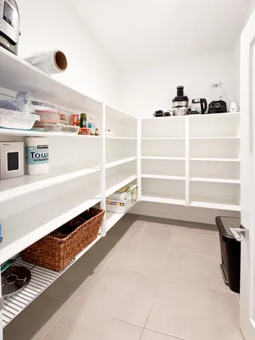 a spacious bedroom with a bed and furniture