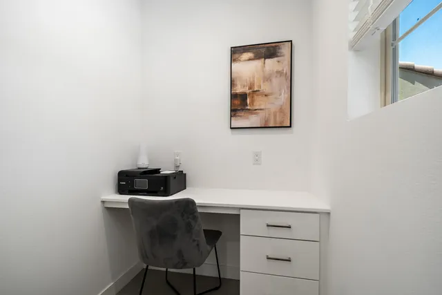 a spacious bedroom with a bed and a couch