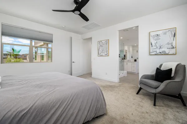 a bathroom with a tub shower and couch