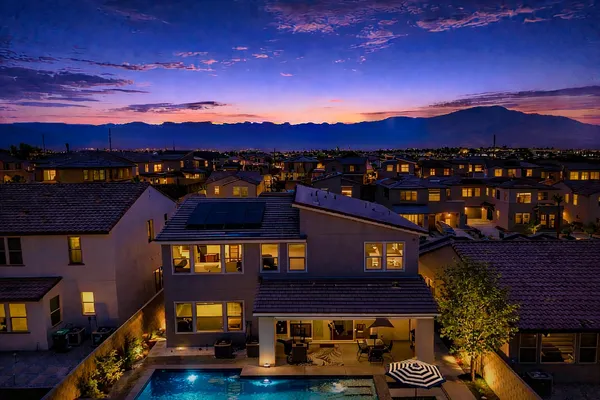 a view of a house with a yard patio and fire pit
