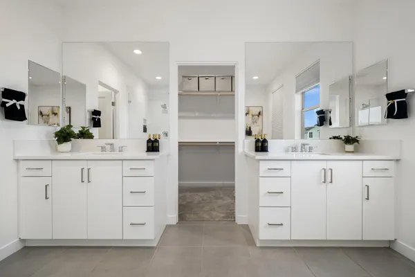 a bed room with a bed and a mirror