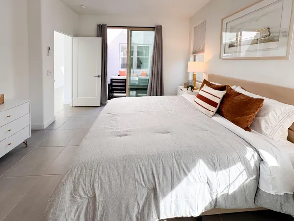 a building outdoor space with patio furniture and potted plants