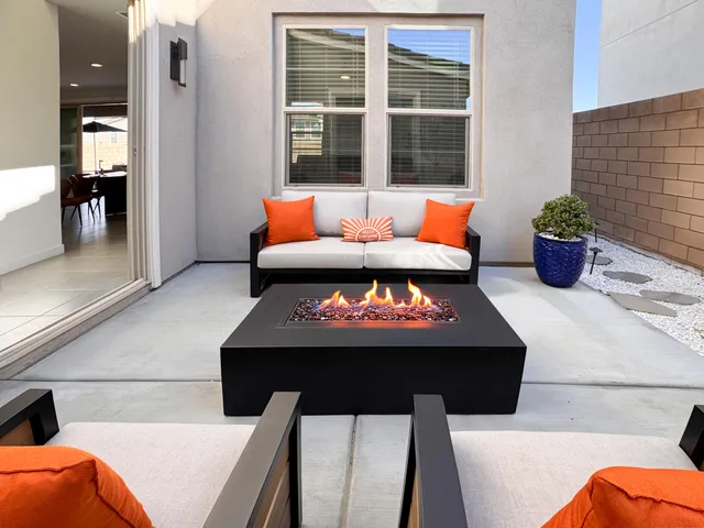 a view of a swimming pool with outdoor seating