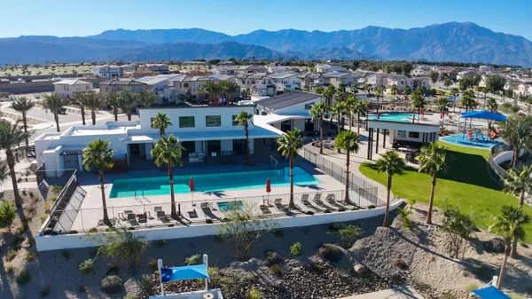 a bathroom with a granite countertop sink mirror and vanity