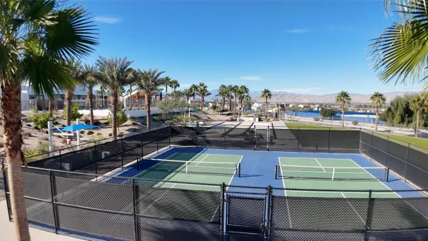a view of a hallway with staircase and white walls