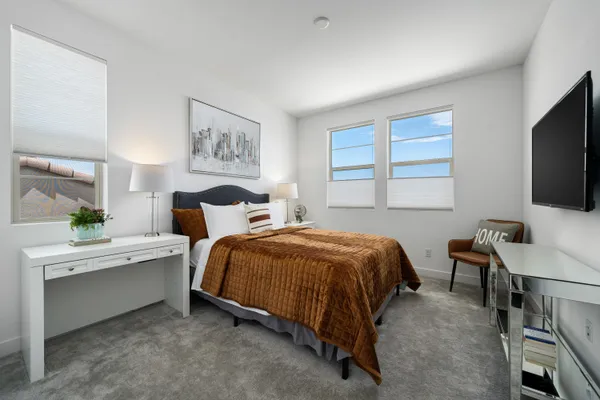 an aerial view of a house with a street