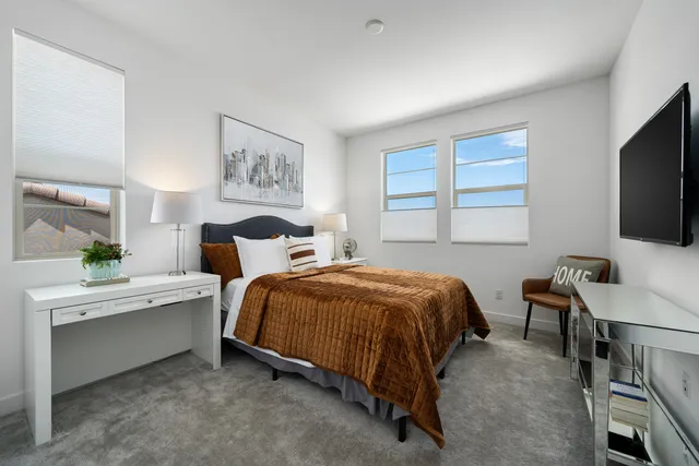 an aerial view of a house with a street