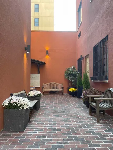 a view of a backyard with sitting area