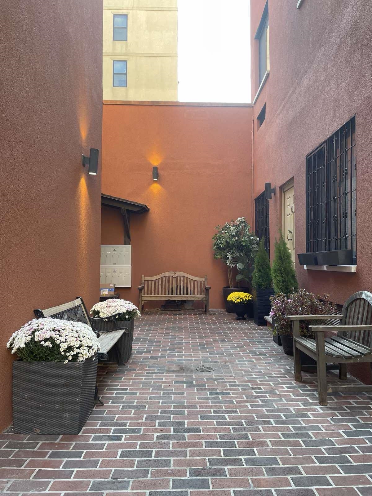 41-43 1st Street, Unit 1G Hoboken, NJ 07030 - Photo 1 of 26 a view of a backyard with sitting area