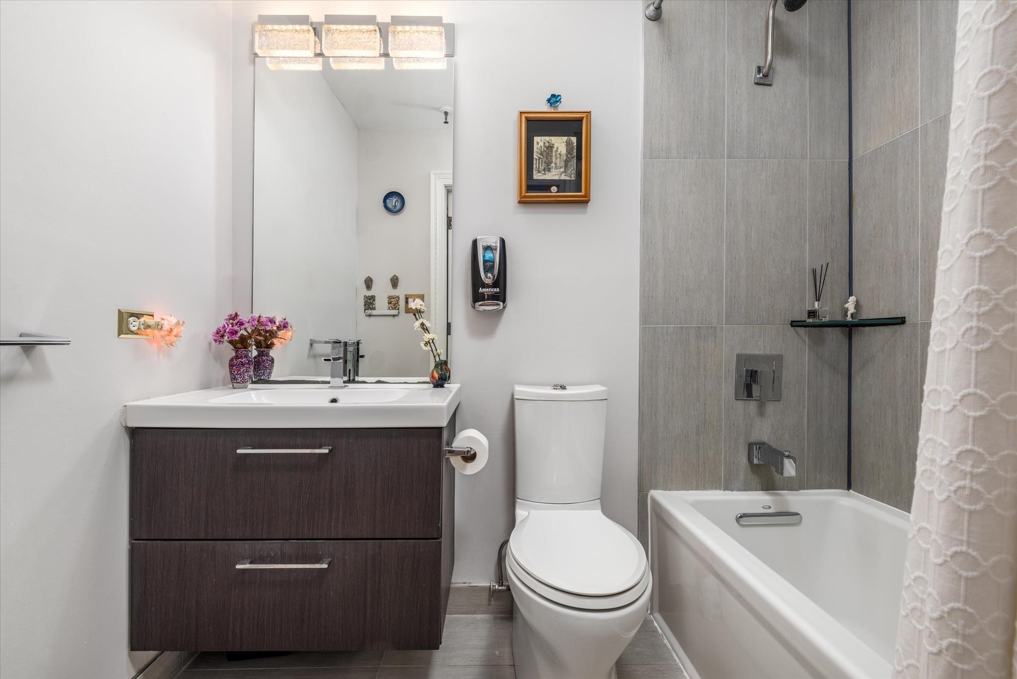 41-43 1st Street, Unit 1G Hoboken, NJ 07030 - Photo 14 of 26 a bathroom with a sink toilet and shower