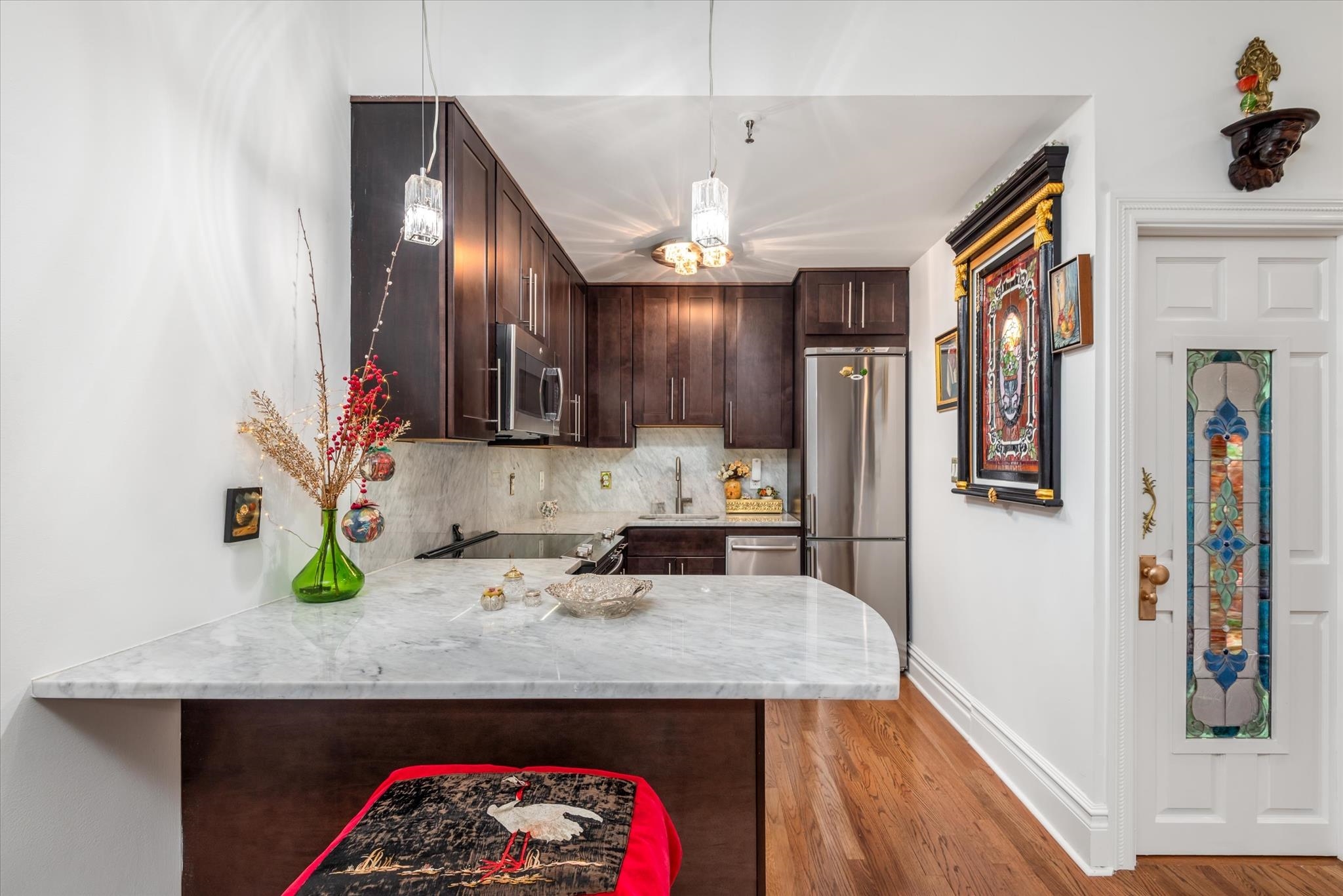 41-43 1st Street, Unit 1G Hoboken, NJ 07030 - Photo 10 of 26 a kitchen with stainless steel appliances granite countertop a refrigerator a stove and a wooden floors
