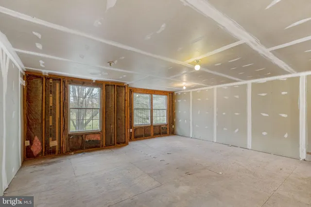 a view of an empty room with a garage