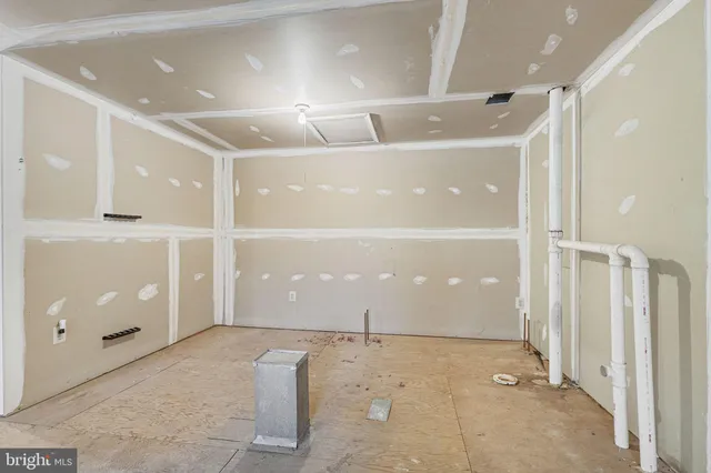 a front view of a house with a fence