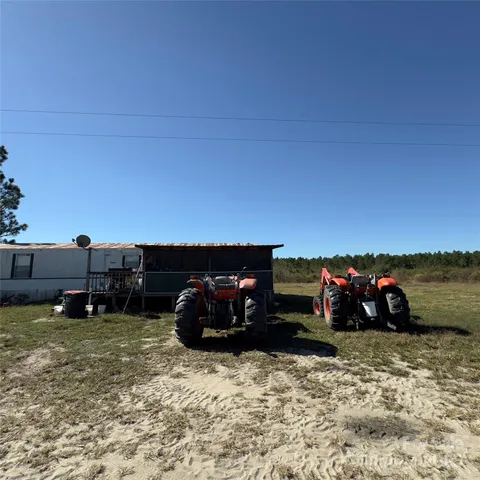 a view of a big room with a big yard and plants