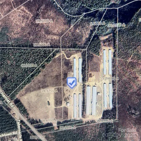 a view of a house with pool and sitting area