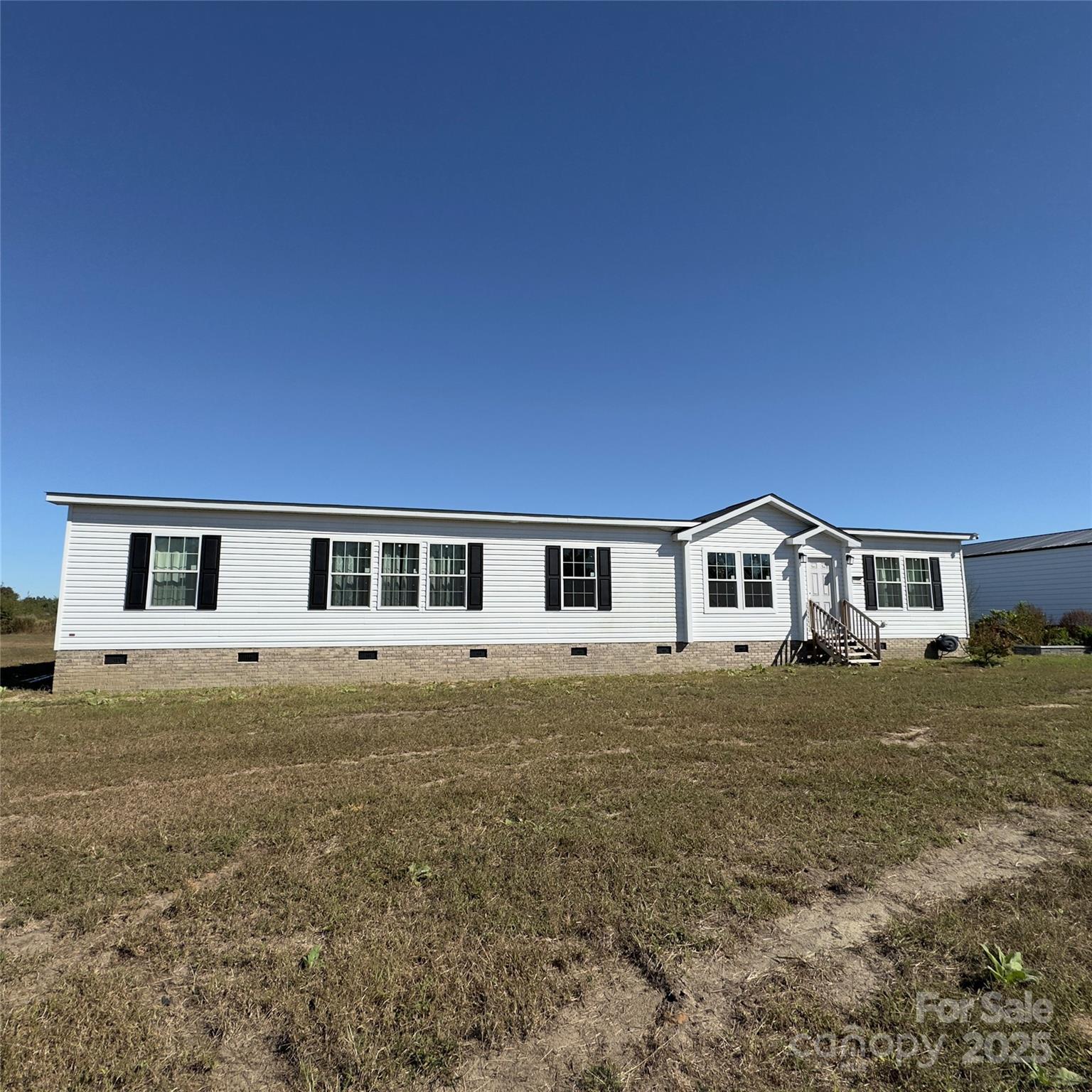 17808 Hamlet Road Laurel Hill, NC 28351 - Photo 37 of 40 a front view of a house with a yard