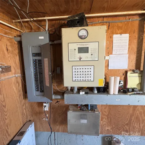 a view of a refrigerator a sink and a window